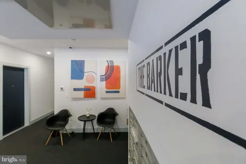 a view of a hallway with chairs