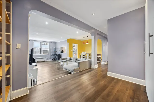 a living room with furniture and large window