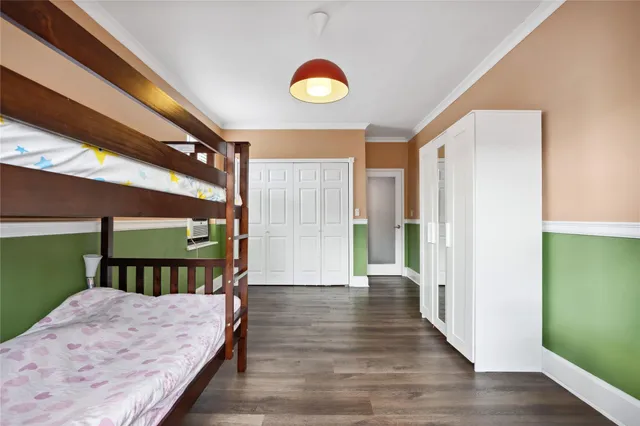 a bedroom with bed and a window