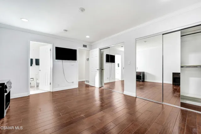 a view of a livingroom with wooden floor