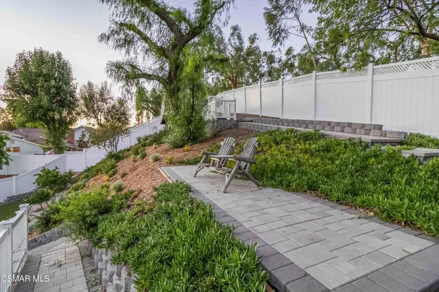 a view of a deck with wooden floor and outdoor seating