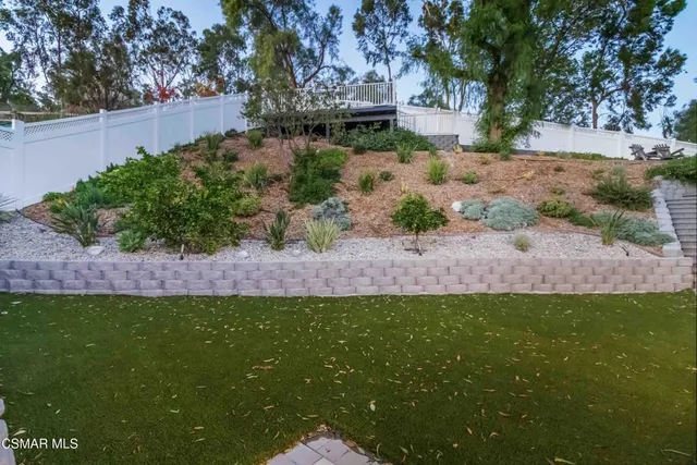 a view of a swimming pool with seating space