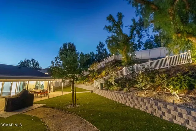 a view of balcony with wooden floor and outdoor seating