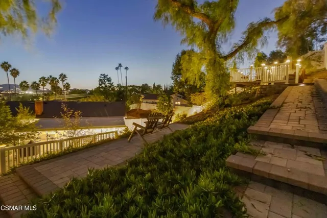 an aerial view of houses with an outdoor space
