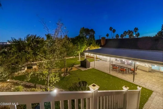 aerial view of a house with yard swimming pool and outdoor seating