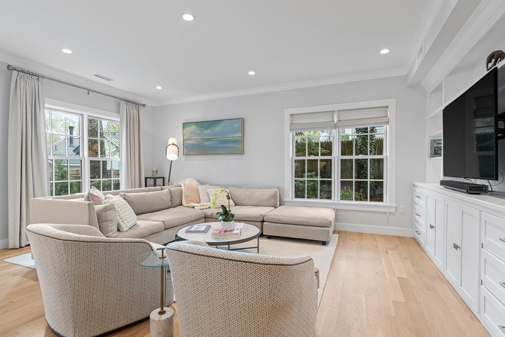 19 River Glen Road Wellesley, MA 02481 - Photo 14 of 31 a living room with furniture and a flat screen tv
