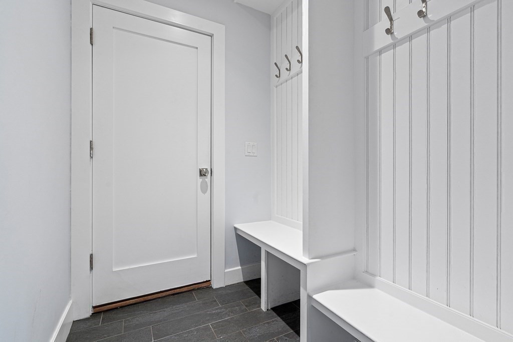 19 River Glen Road Wellesley, MA 02481 - Photo 16 of 31 a bathroom with a sink and a mirror