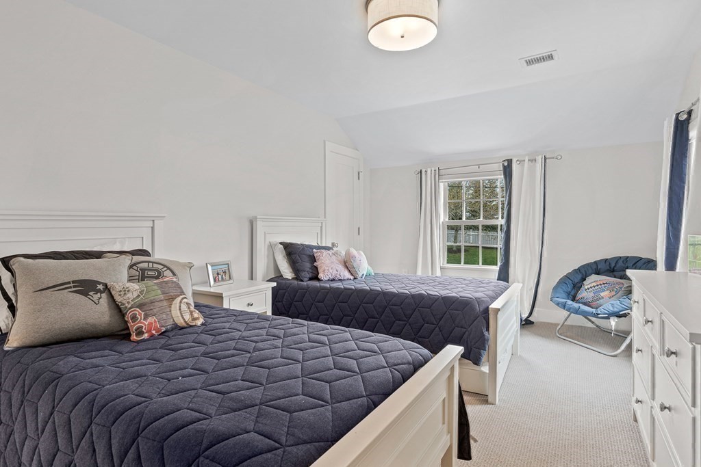19 River Glen Road Wellesley, MA 02481 - Photo 18 of 31 a bedroom with a bed and a window
