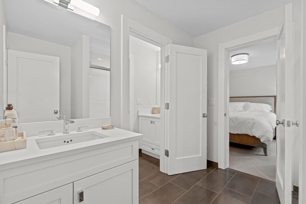 19 River Glen Road Wellesley, MA 02481 - Photo 21 of 31 a en suite bathroom with a sink and a mirror