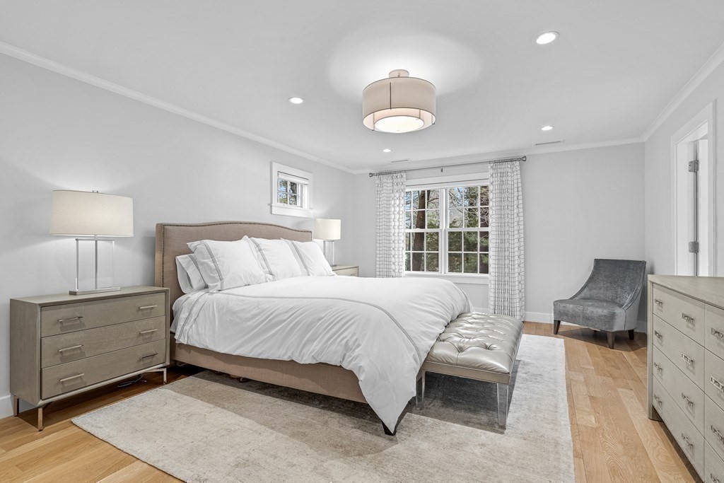 19 River Glen Road Wellesley, MA 02481 - Photo 22 of 31 a bedroom with a bed and a dresser