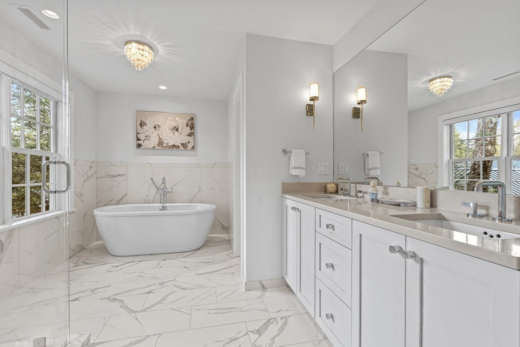 19 River Glen Road Wellesley, MA 02481 - Photo 25 of 31 a bathroom with a granite countertop sink mirror and bathtub