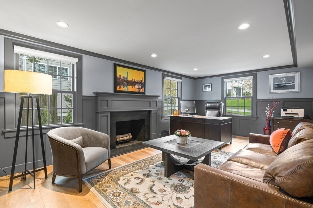 19 River Glen Road Wellesley, MA 02481 - Photo 3 of 31 a living room with furniture a fireplace and a flat screen tv