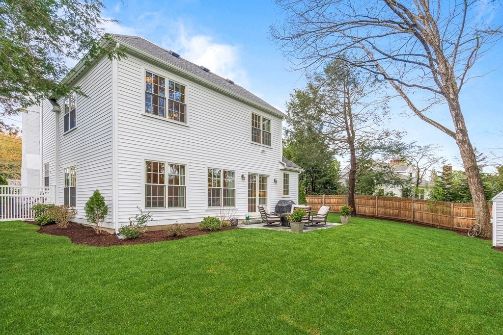 19 River Glen Road Wellesley, MA 02481 - Photo 31 of 31 a front view of house with yard and outdoor seating