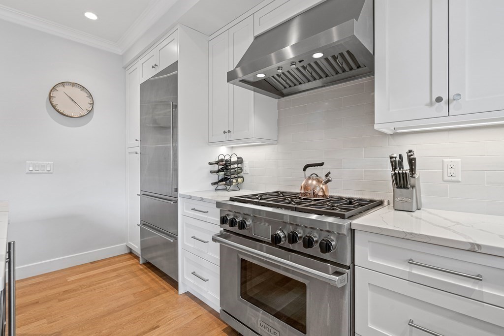 19 River Glen Road Wellesley, MA 02481 - Photo 8 of 31 a stove top oven sitting inside of a kitchen