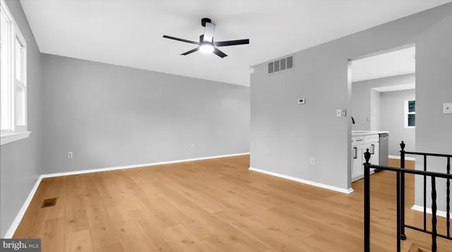 a view of hallway with wooden floor