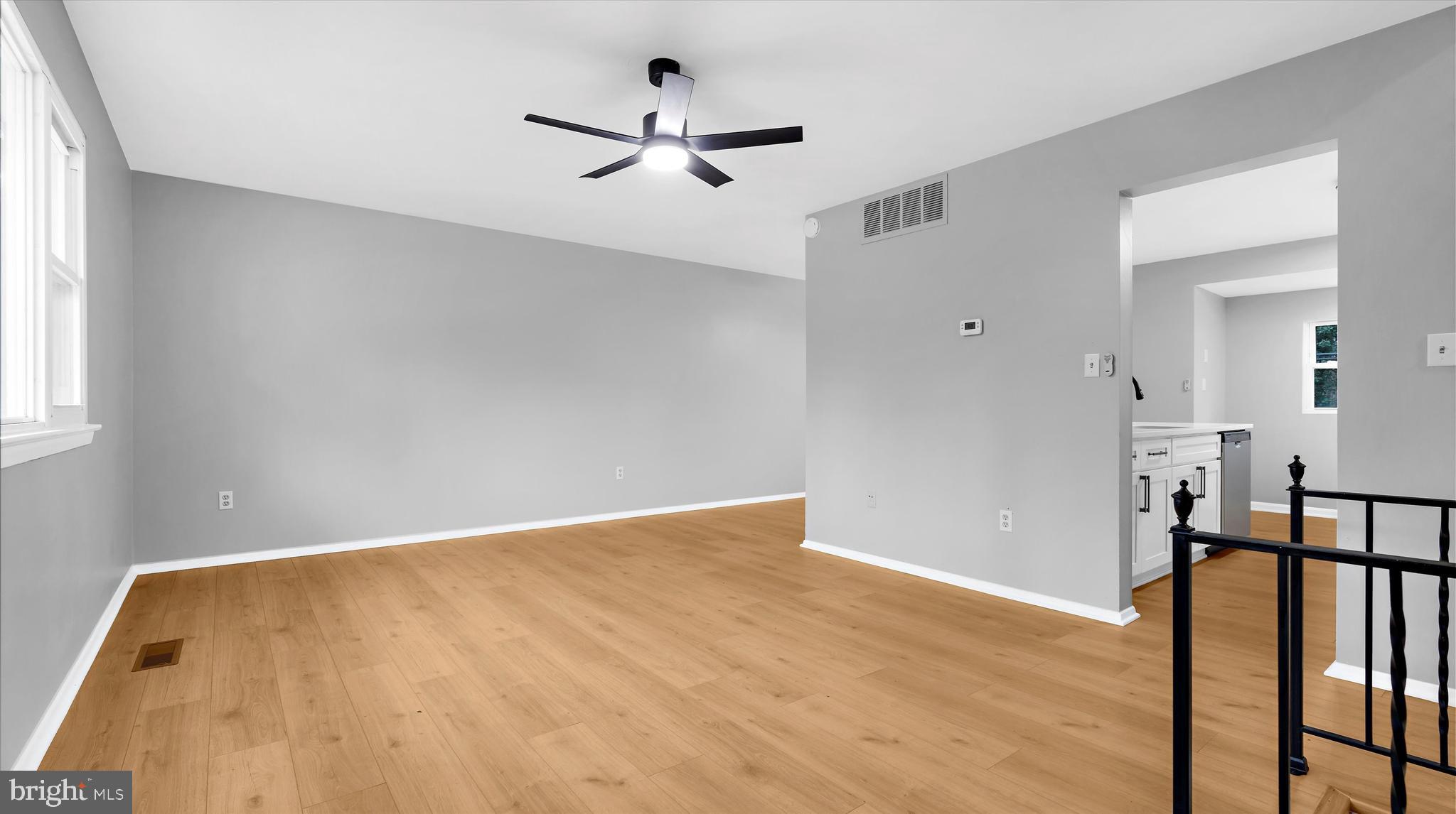 8009 Nolcrest Road Glen Burnie, MD 21061 - Photo 11 of 35 a view of hallway with wooden floor