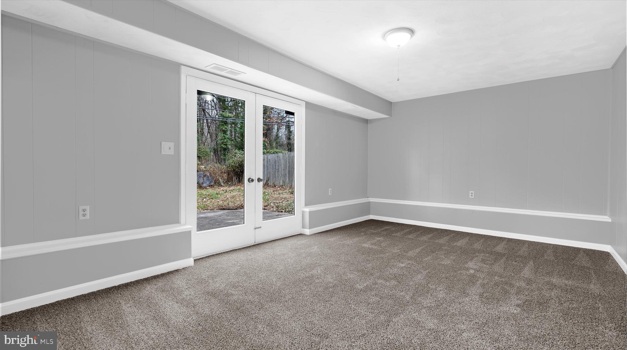 8009 Nolcrest Road Glen Burnie, MD 21061 - Photo 9 of 35 a view of an empty room with a window