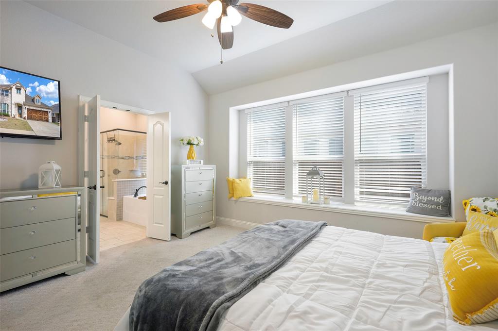 4059 Three Forks Road Kaufman, TX 75142 - Photo 15 of 25 a spacious bedroom with a large bed and a window