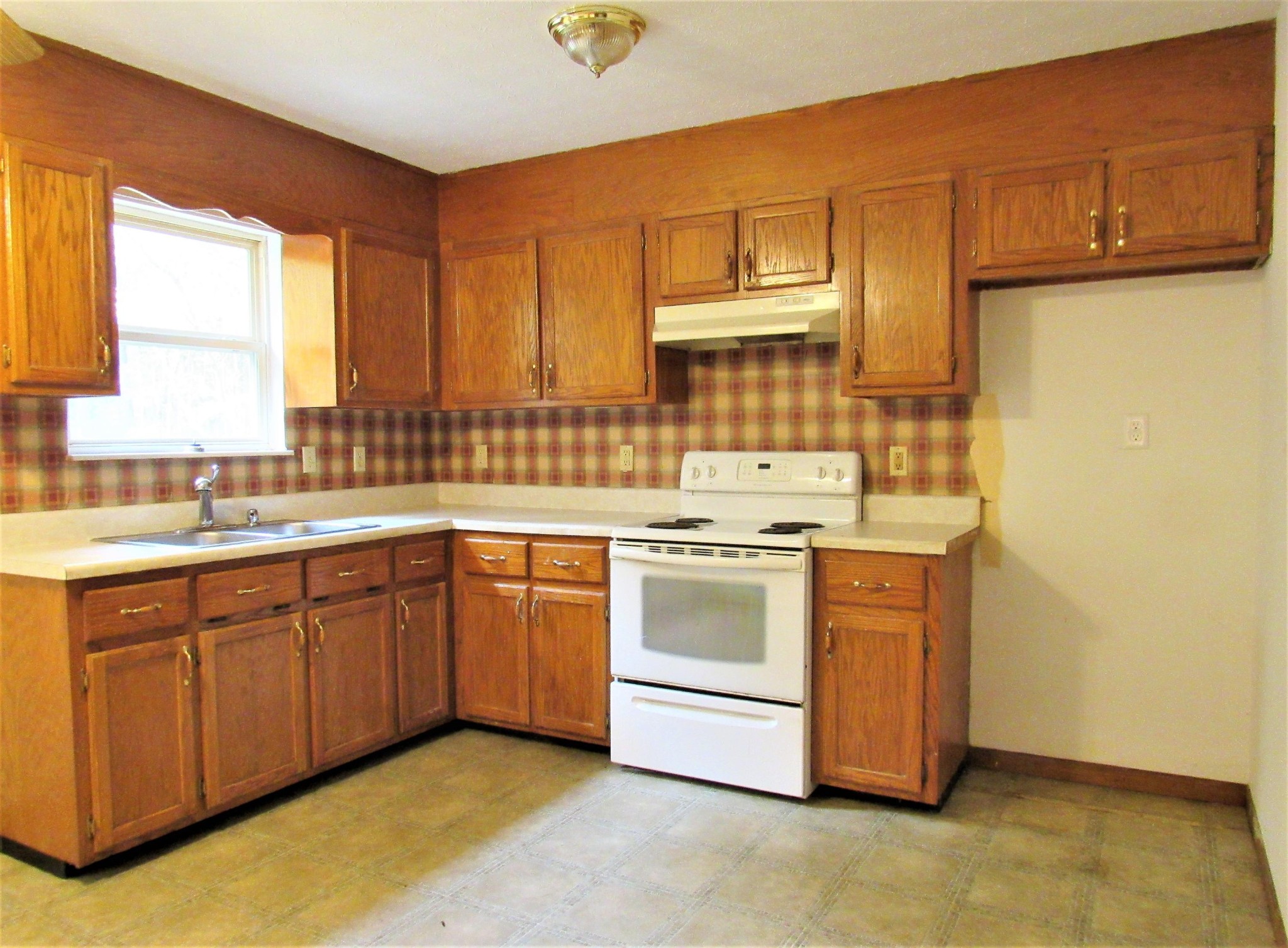 144 Ross Williams Road Lancing, TN 37770 - Photo 4 of 21 a kitchen with a sink cabinets and window