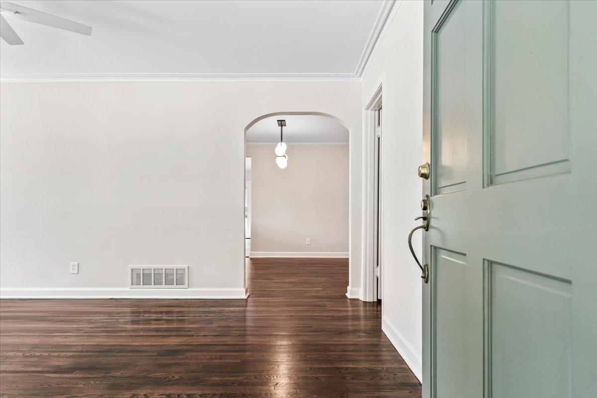 170 South Greer Street Memphis, TN 38111 - Photo 33 of 35 Entryway with a light blue paneled door, brass hardware, and dark wood-finish flooring