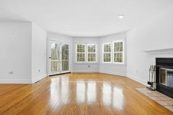 a white bath tub sitting next to a window