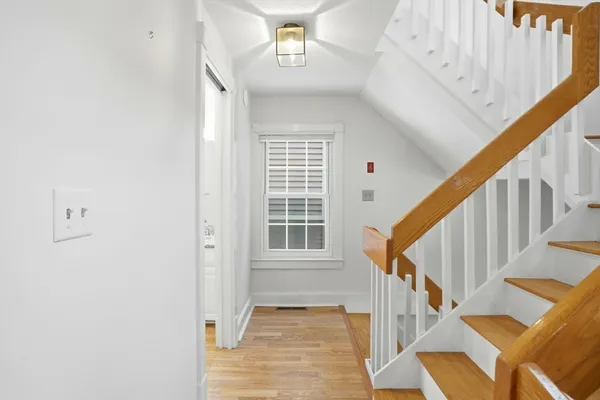 an empty room with a empty space and windows