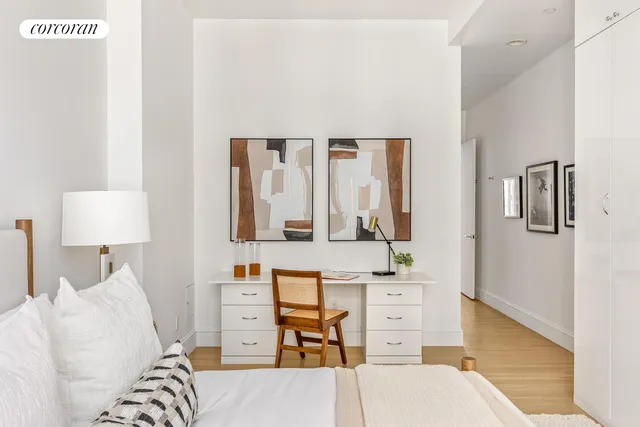 a living room with furniture and a lamp