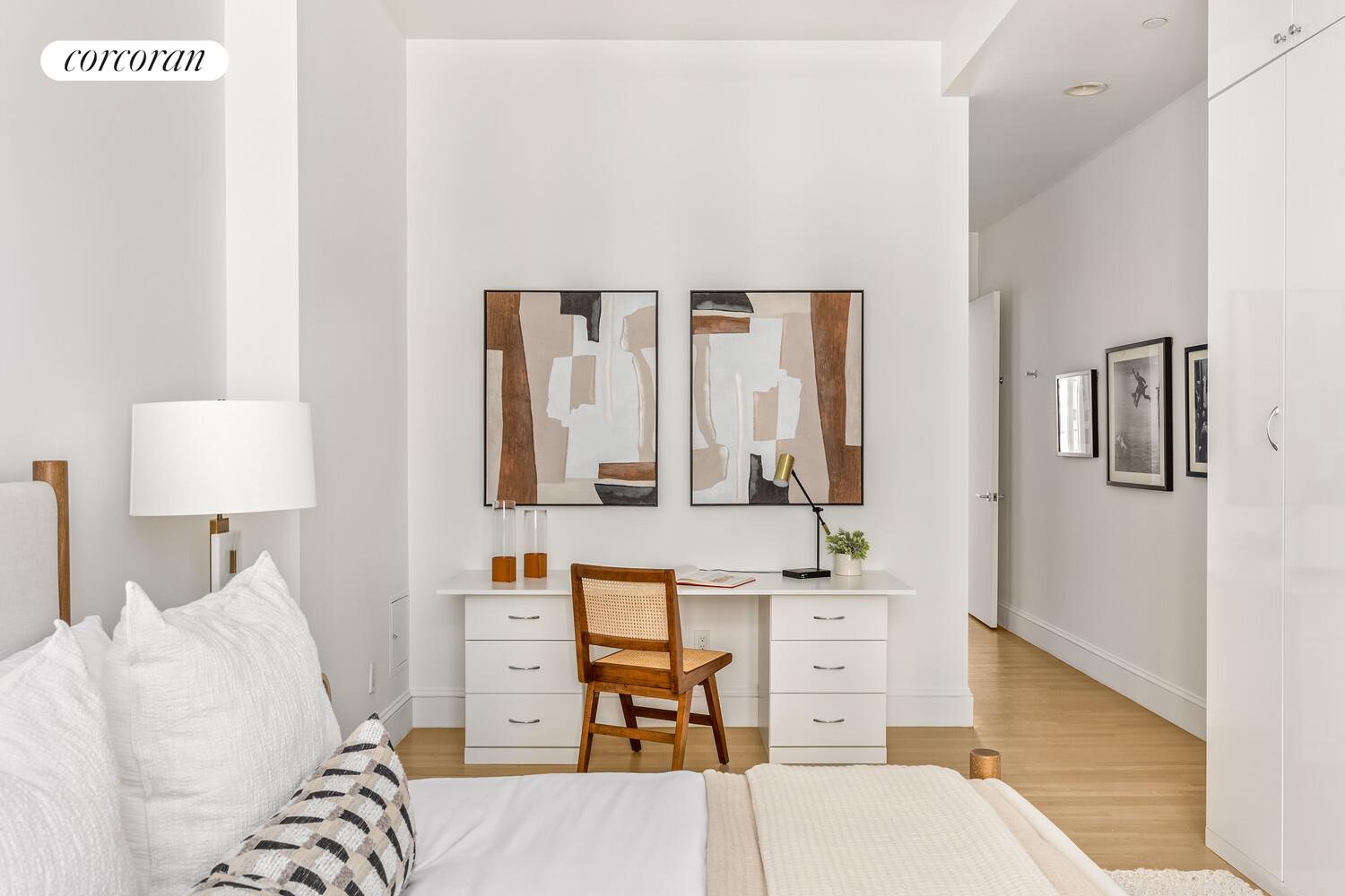 129 Lafayette Street, Unit 8C Manhattan, NY 10013 - Photo 5 of 11 a living room with furniture and a lamp