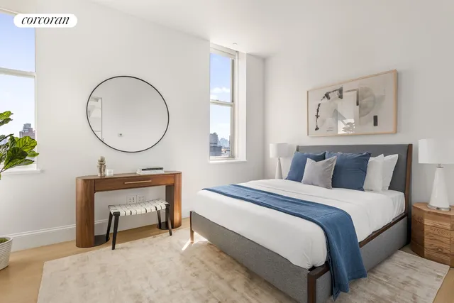 a bedroom with bed and a painting on the wall