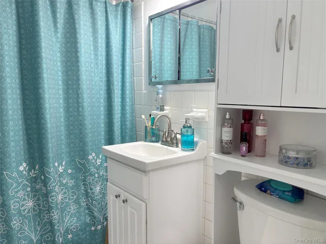 a view of a kitchen with stainless steel appliances granite countertop a stove and a sink