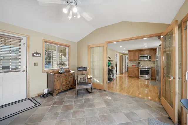 a view of a livingroom with furniture and a window