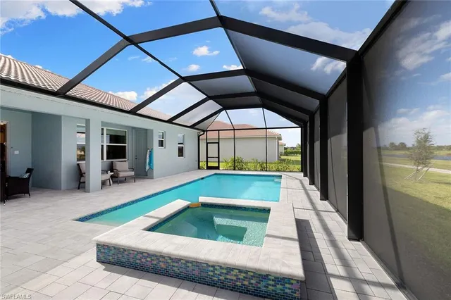 a view of swimming pool with seating area