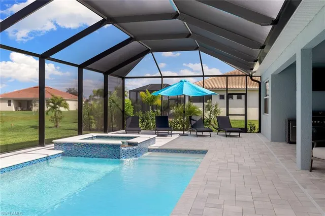 a view of swimming pool with a patio