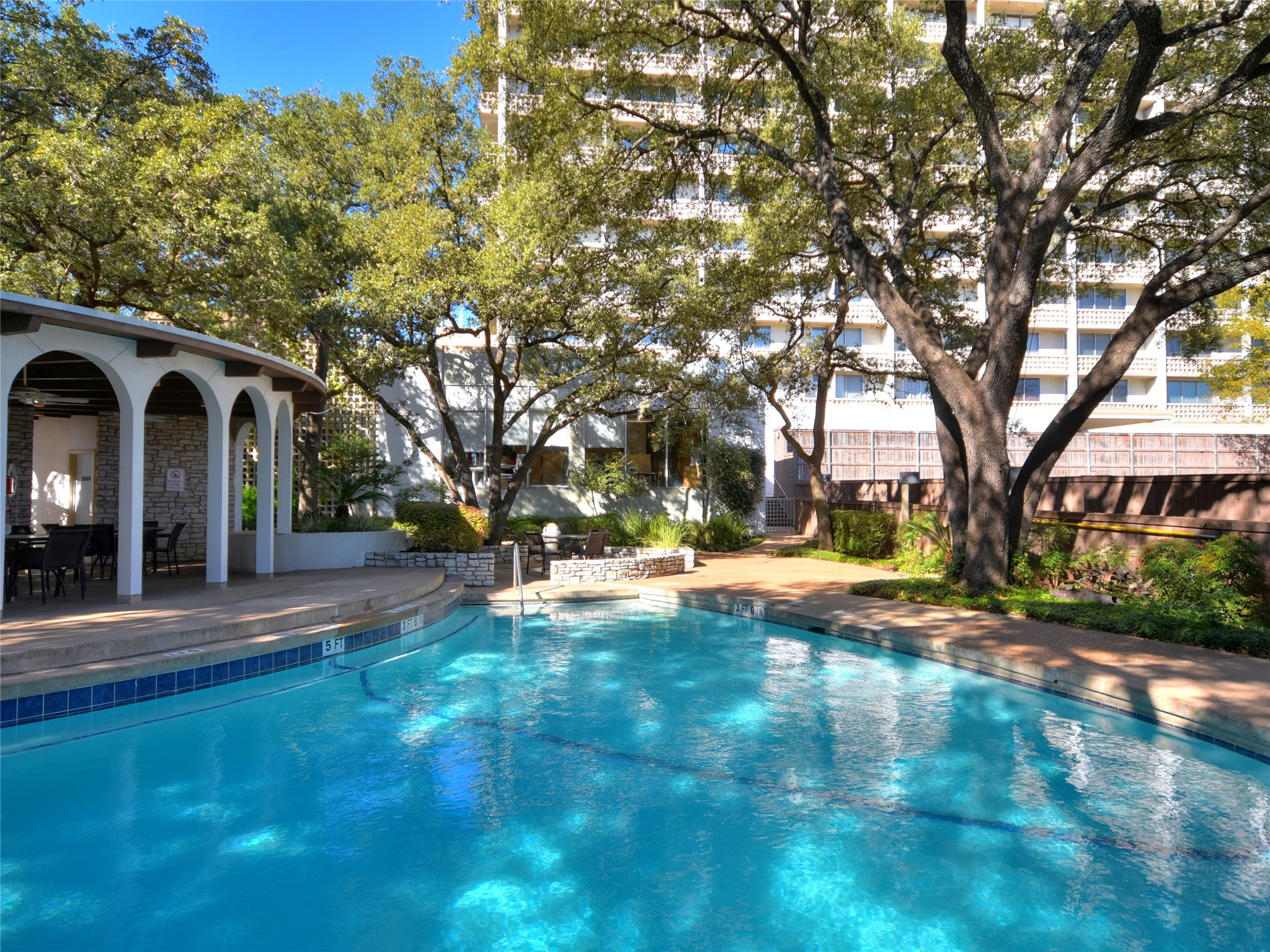 1801 Lavaca Street, Unit 7L Austin, TX 78701 - Photo 22 of 25 a view of a house with large trees
