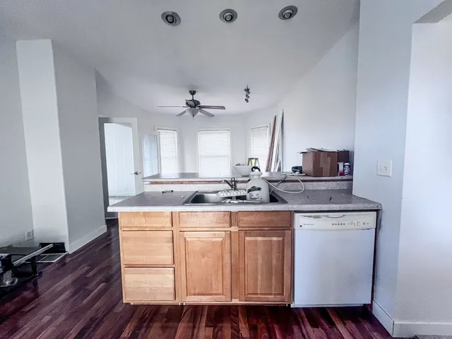 a kitchen with a sink and cabinets