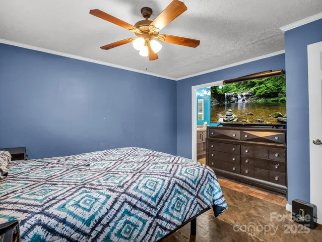 a bathroom with a granite countertop sink toilet and mirror