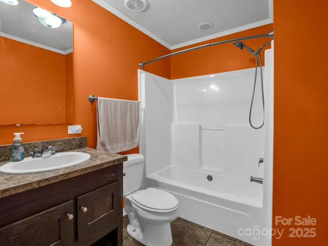 a view of a livingroom with furniture and a flat screen tv