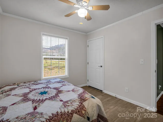 a view of a house with wooden floor next to a yard