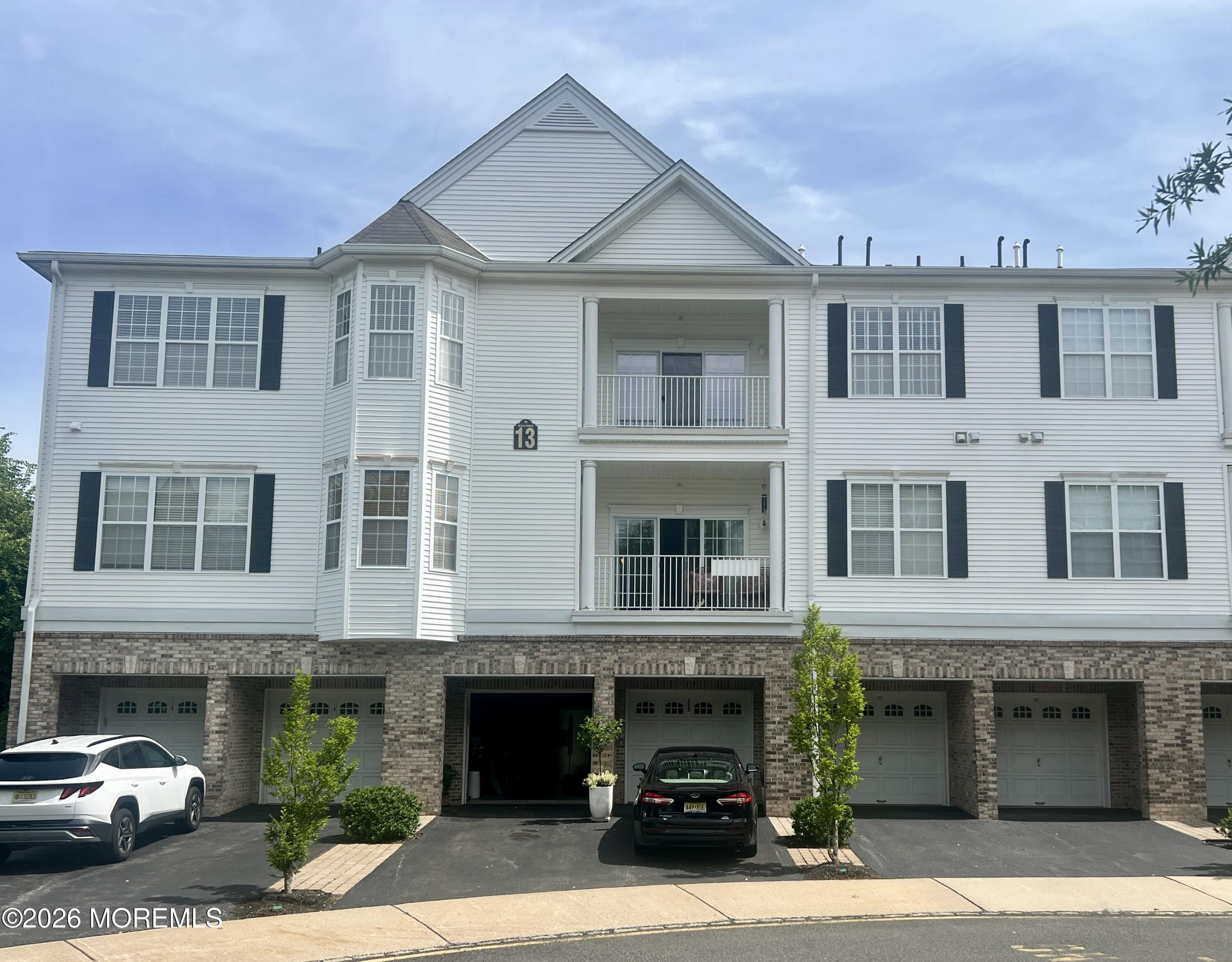 106 Potts Road Morganville, NJ 07751 - Photo 1 of 25 a view of building with a street view