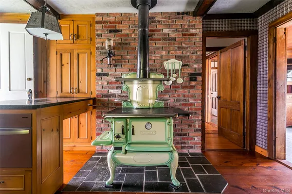 a view of a chairs and table in a balcony