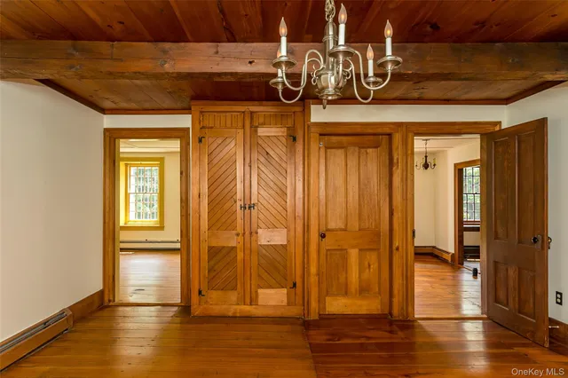 a view of an entryway with wooden floor