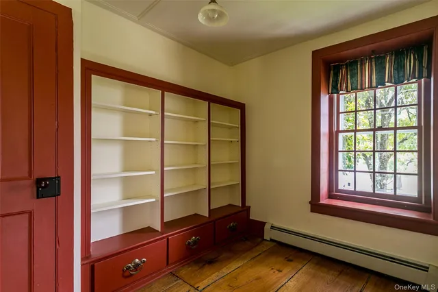 a room with window and furniture