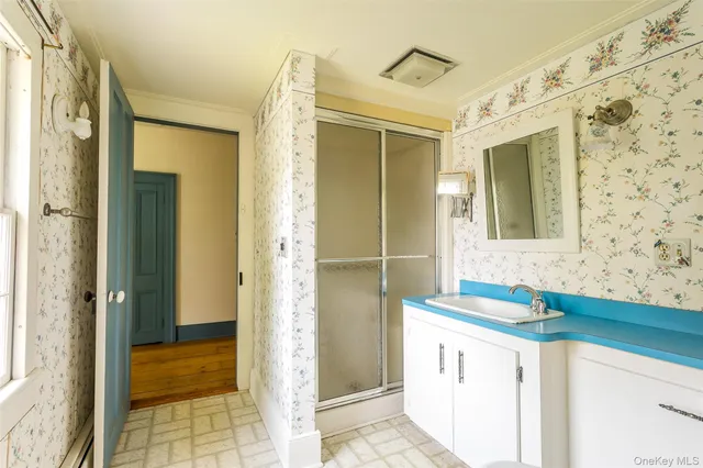 a bathroom with a sink and a mirror