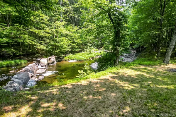 an aerial view of a houses with yard