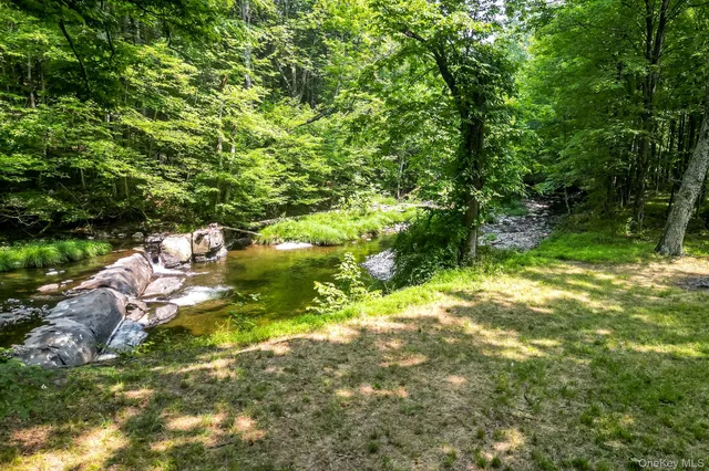 an aerial view of a houses with yard