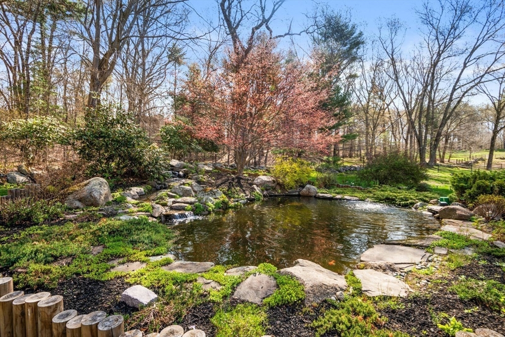 2 Spingler Way Hamilton, MA 01982 - Photo 8 of 40 a backyard of a house with lots of green space