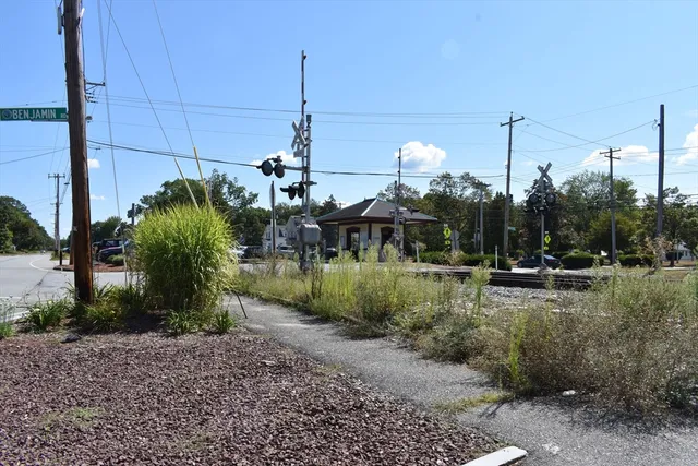 a view of a garden with sitting area