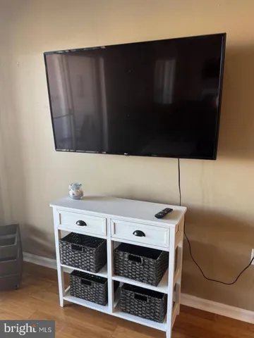 a view of table chair and cabinet