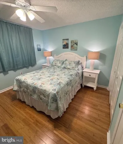 a bedroom with bed and window