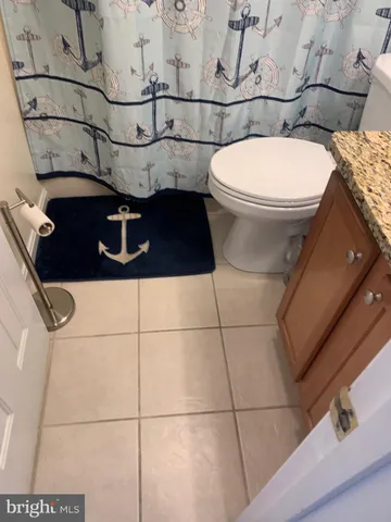 a bathroom with a toilet and a sink